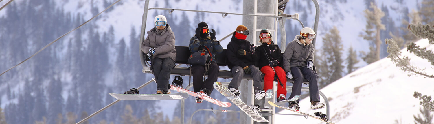 Skiers and Snowboarders on a ski lift